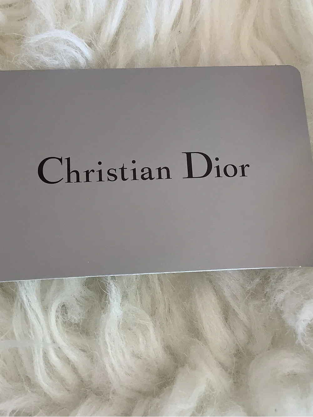 Christian Dior Voyageur wallet made of sage green patent leather